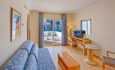 a living room with a couch and a flat screen tv