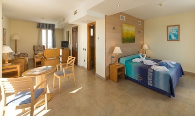 a hotel room with a bed and a table