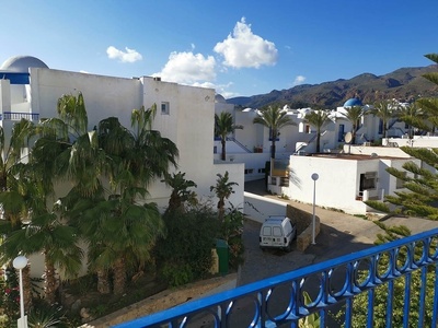 a white van is parked in front of a white building
