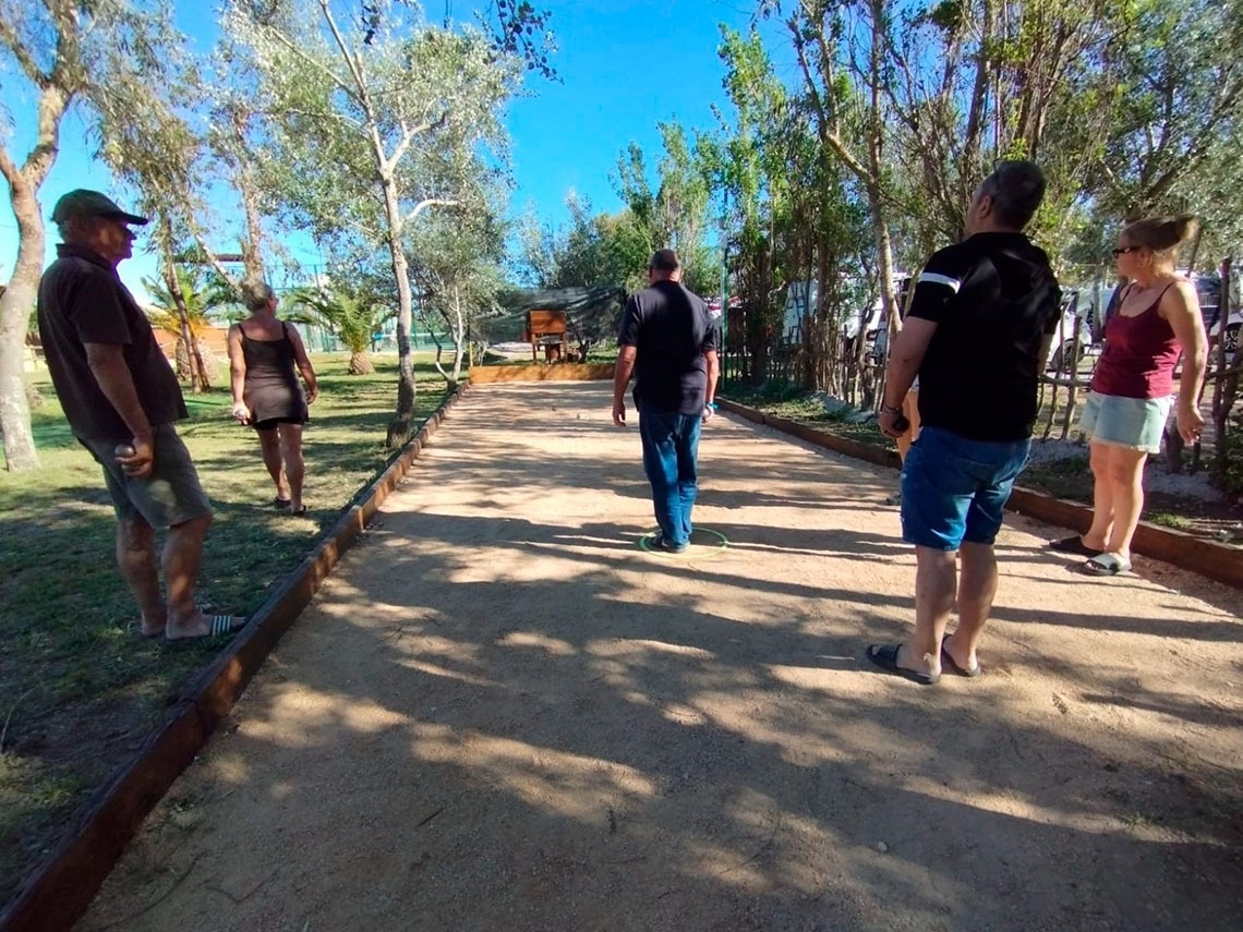 a group of people are playing a game of bocce ball