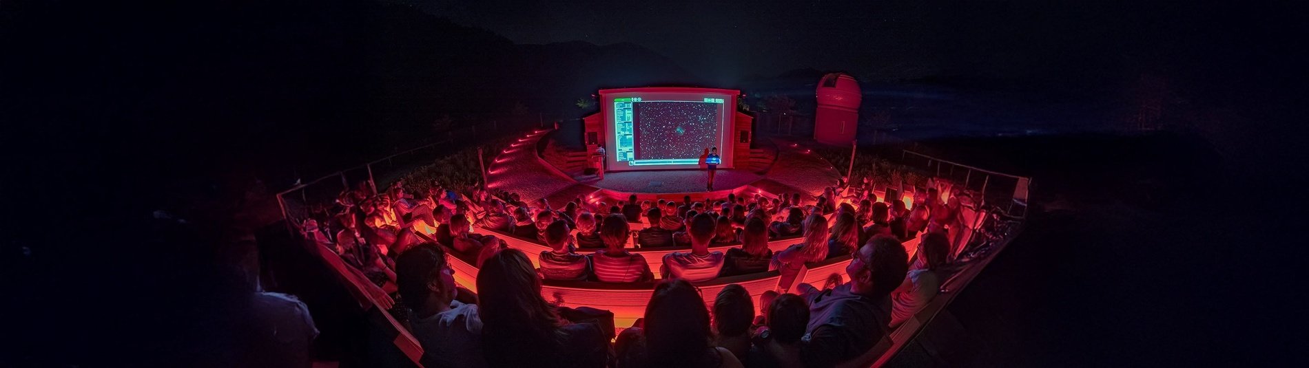 a group of people dressed in halloween costumes are standing in a dark room