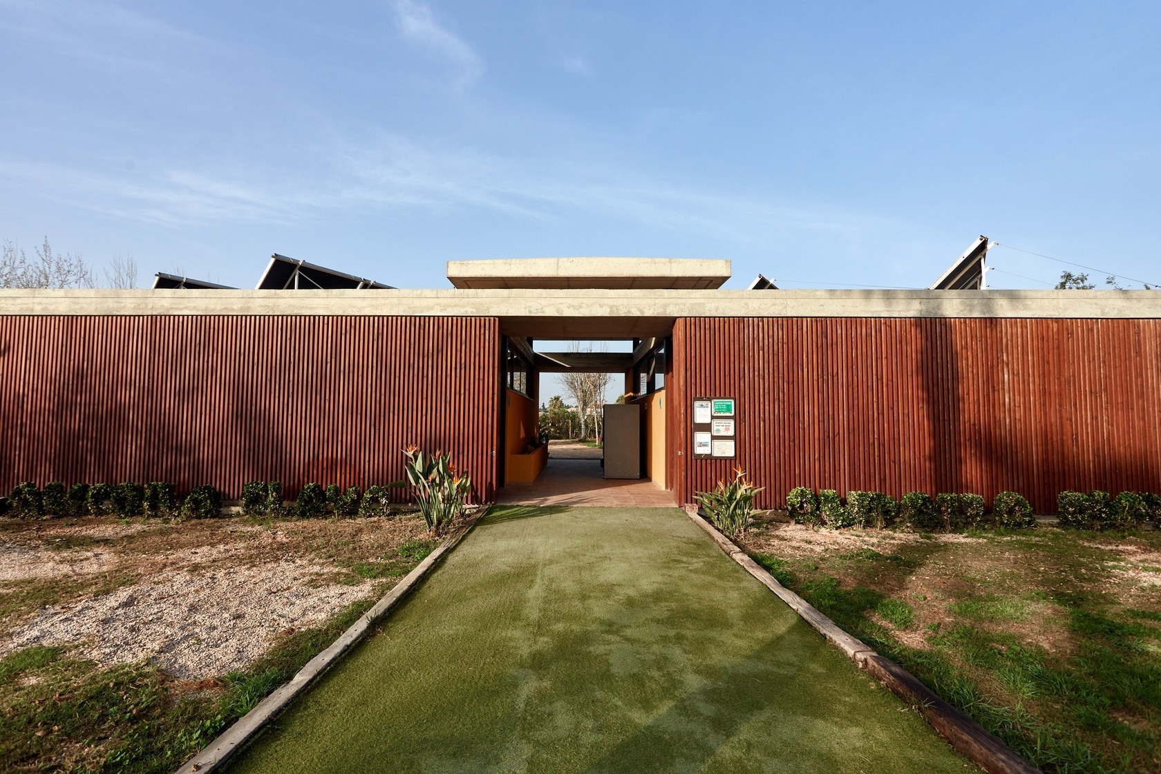 a building with a green sign that says ' ambulance ' on it