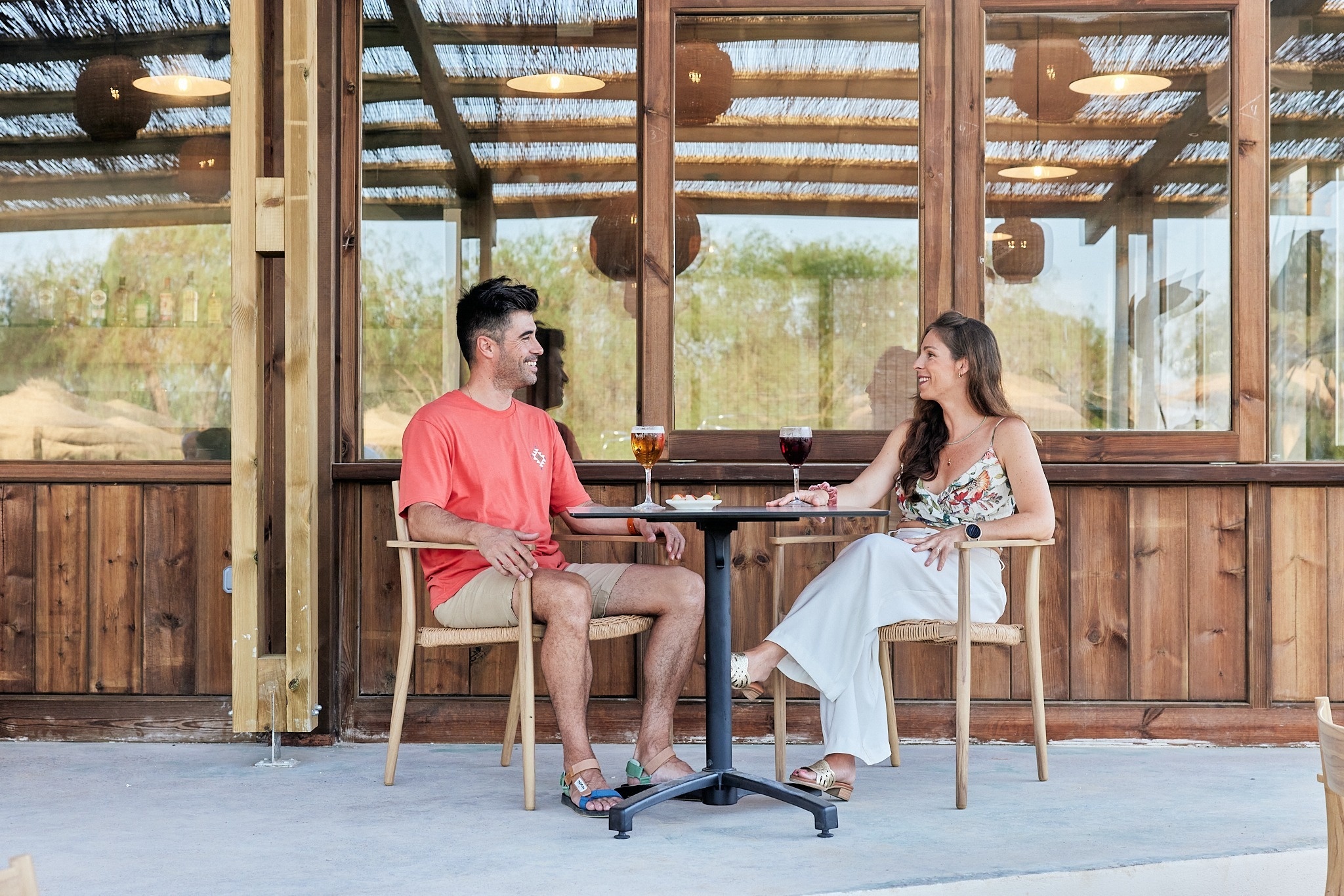 a view of a swimming pool through a glass door