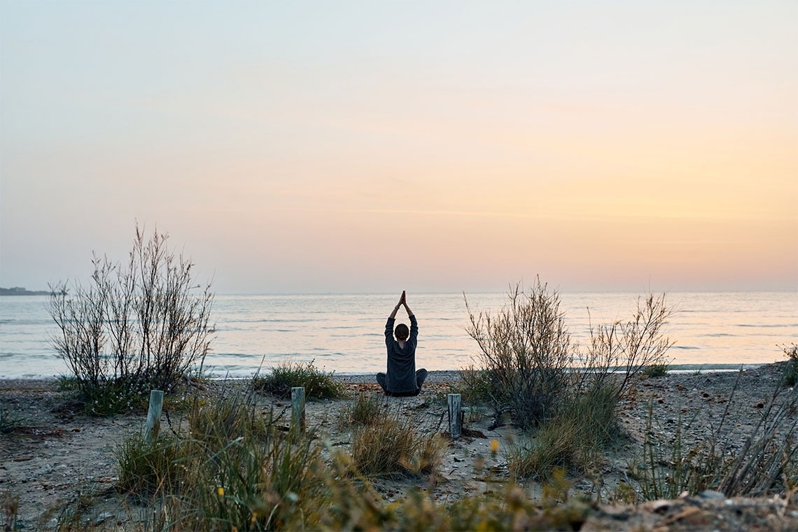 a person standing in front of a tent decorated for halloween
