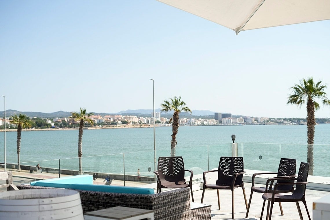 a boy and a girl are playing tennis on a court