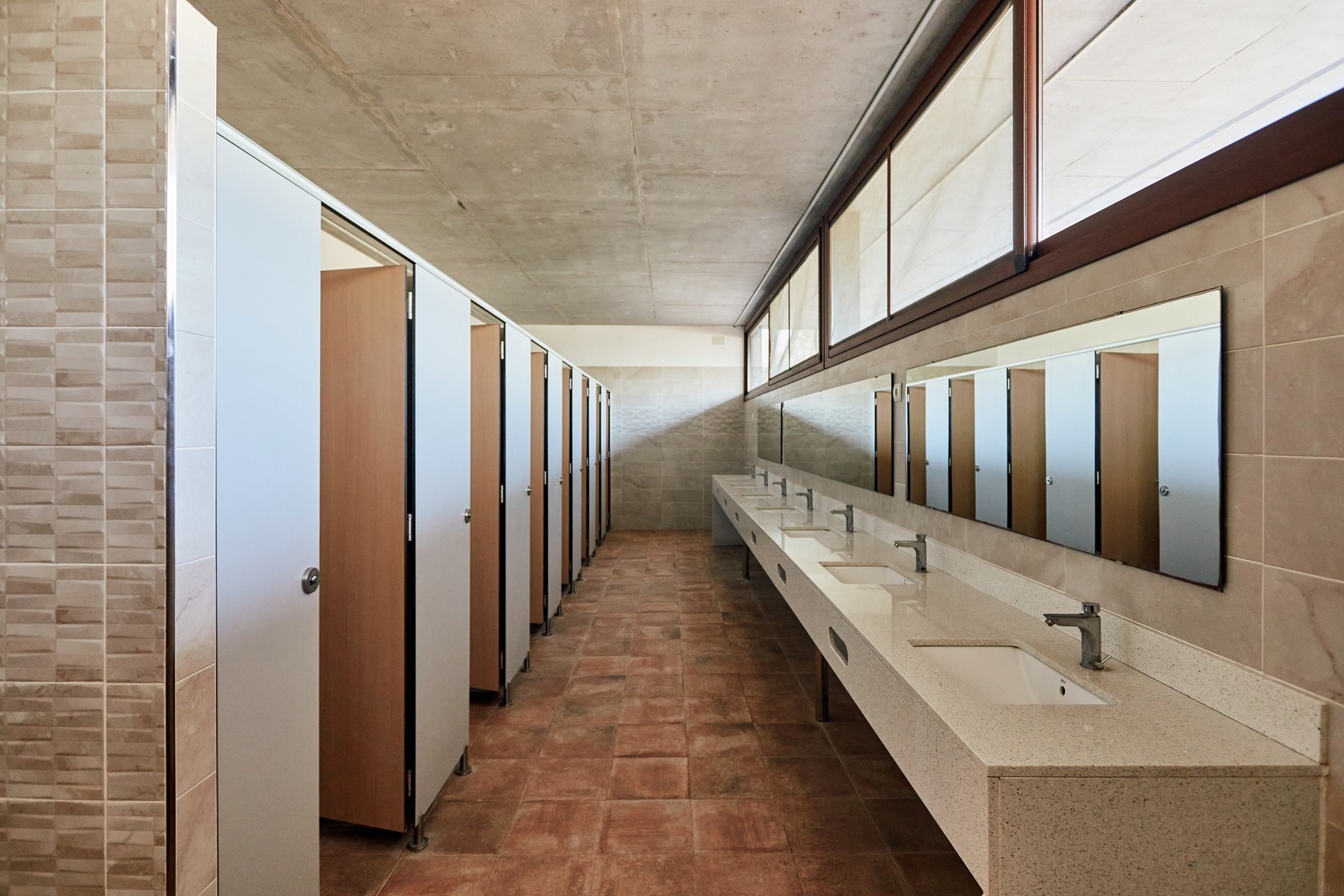 a bathroom with a lot of sinks and mirrors