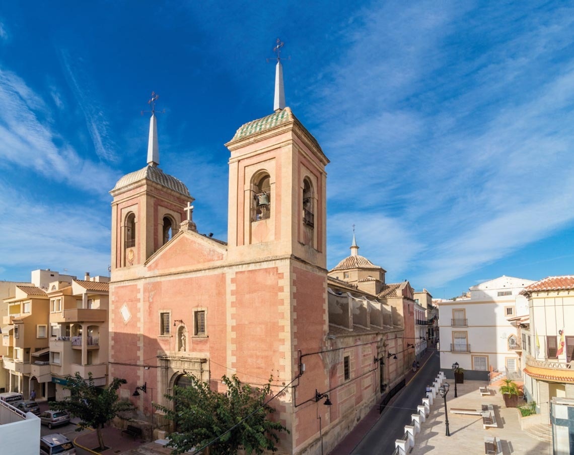 a church with a blue sky in the background