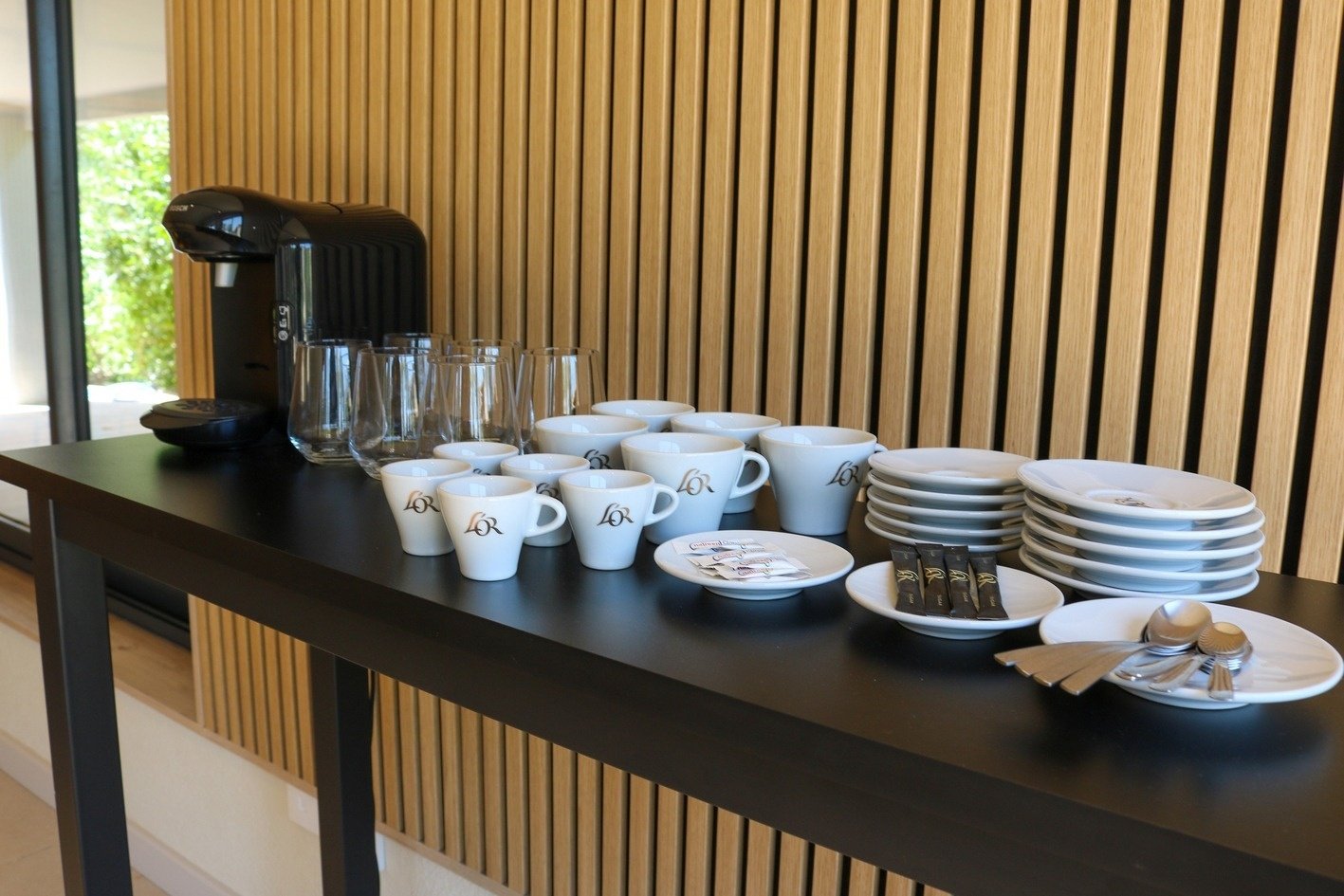 a table with a lot of cups and saucers that say lor