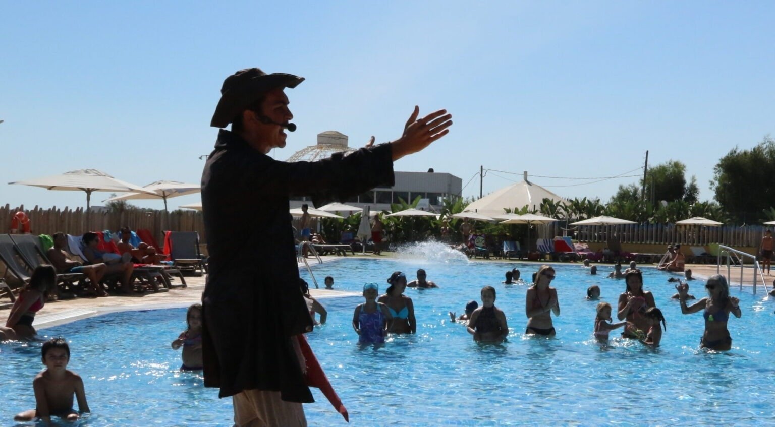 a boy and a girl are playing tennis on a court