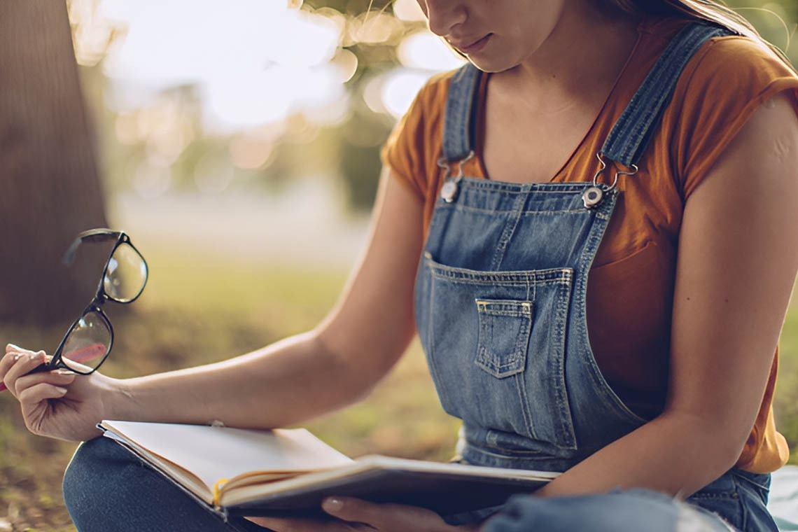 a man giving a thumbs up while flying in a parachute