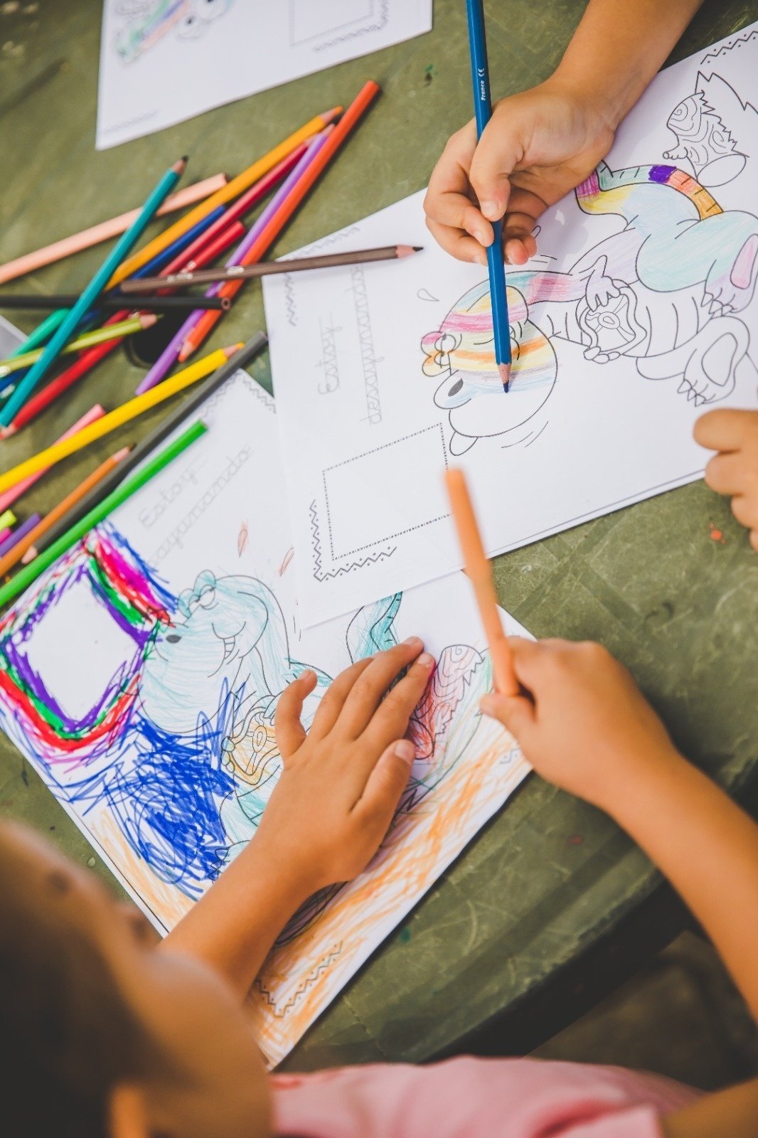 two young boys are playing in an inflatable pool