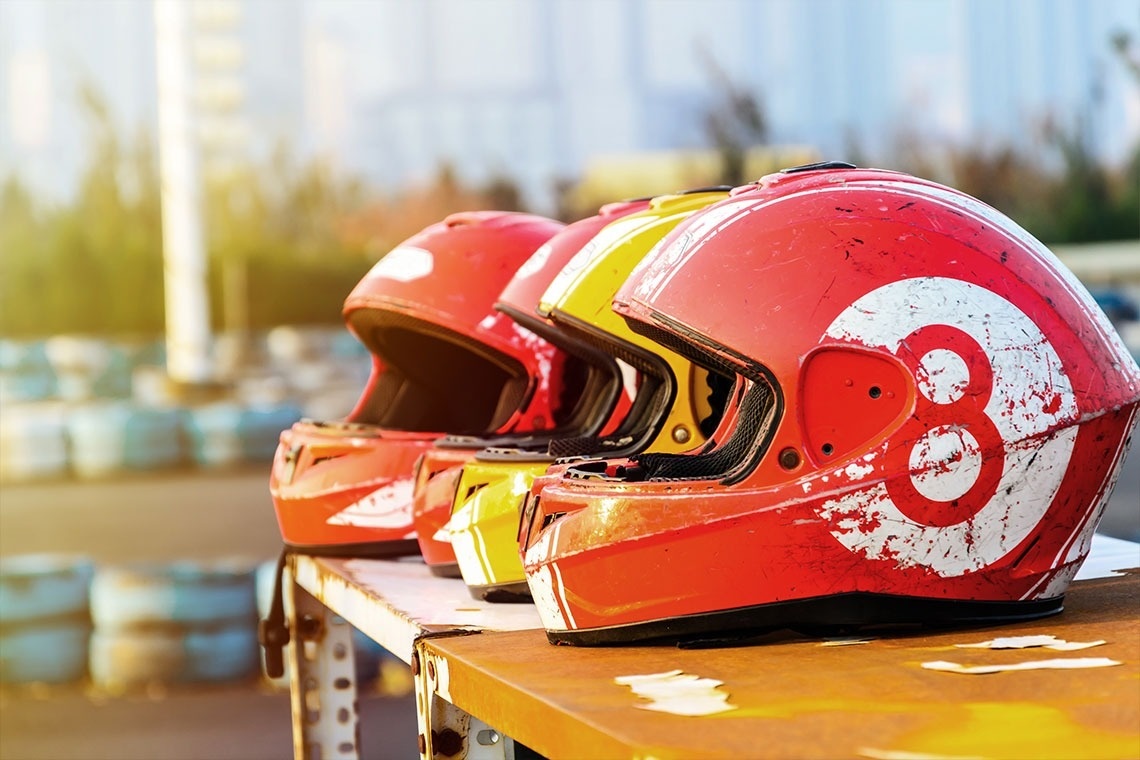 a man and a woman are riding horses on the beach