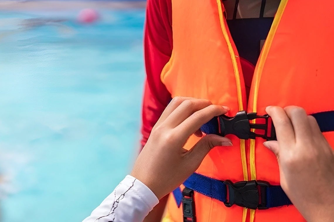 a man and a woman are paddling kayaks on a lake