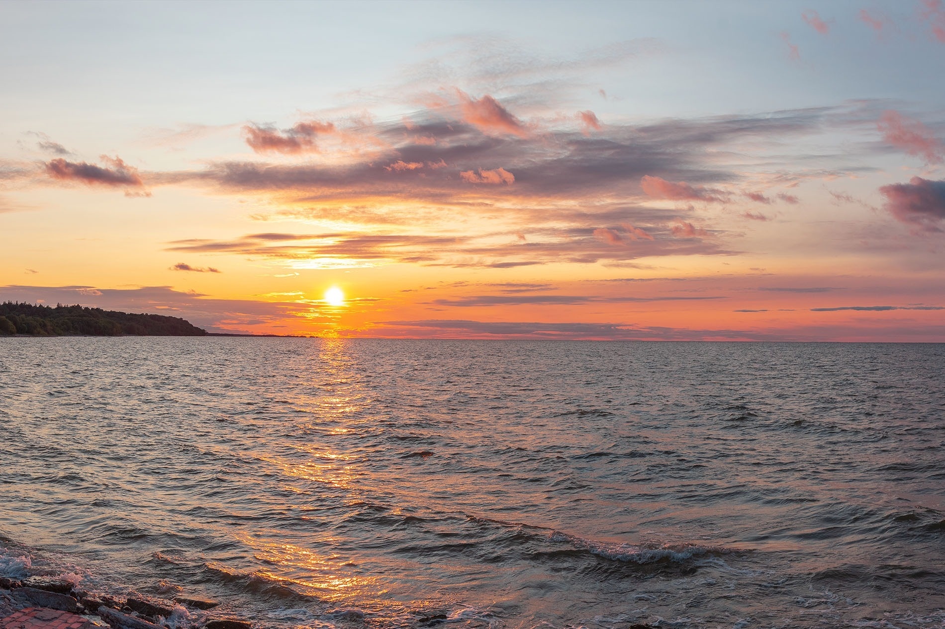a man riding a horse with a green and yellow flag behind him