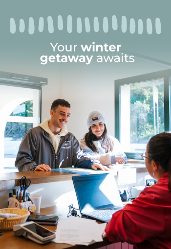 Your winter getaway awaits: happy couple checking in at a hotel. TAIGA Benidorm (formerly Camping La Media legua) | Campsites