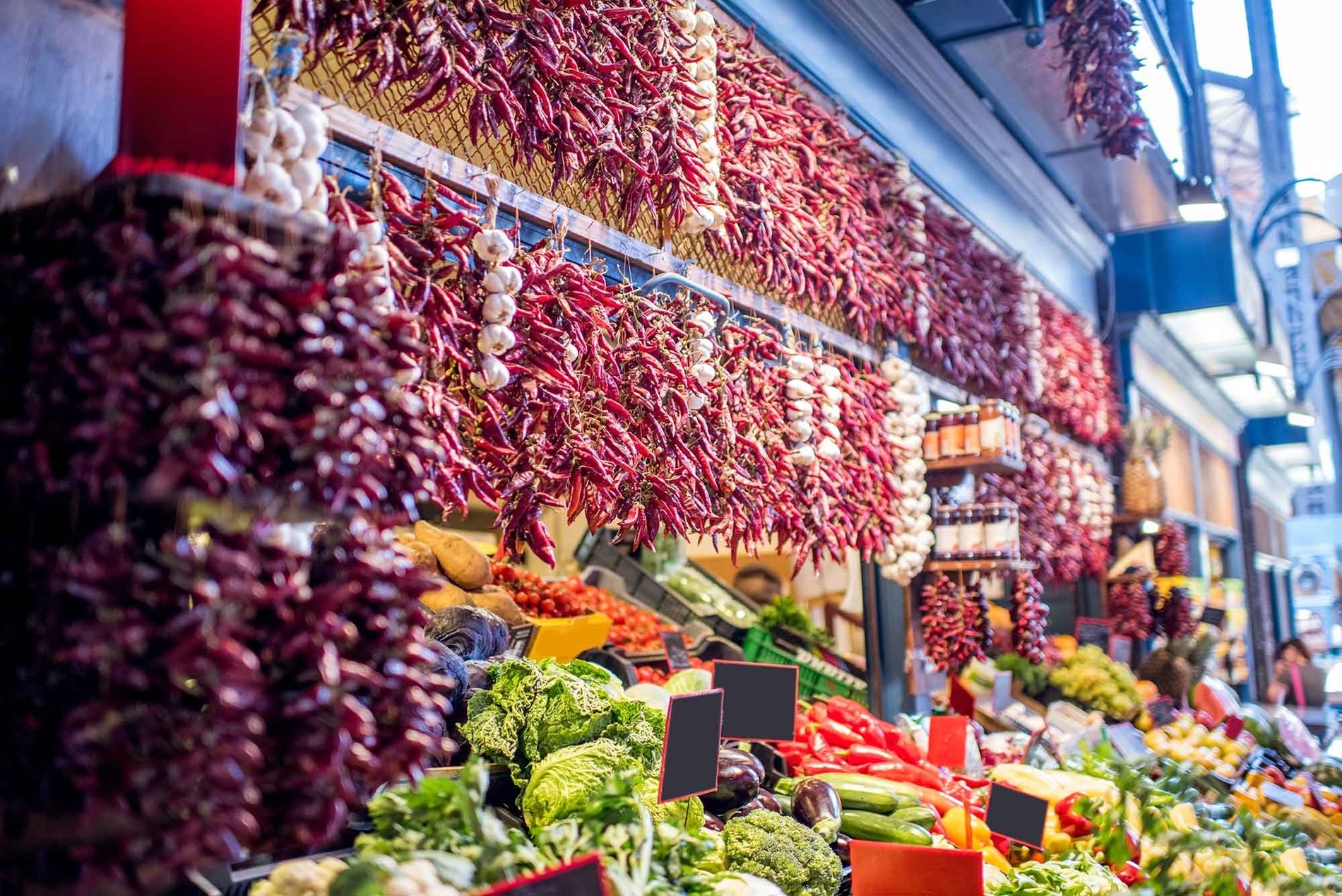 a variety of fruits and vegetables are displayed at a market