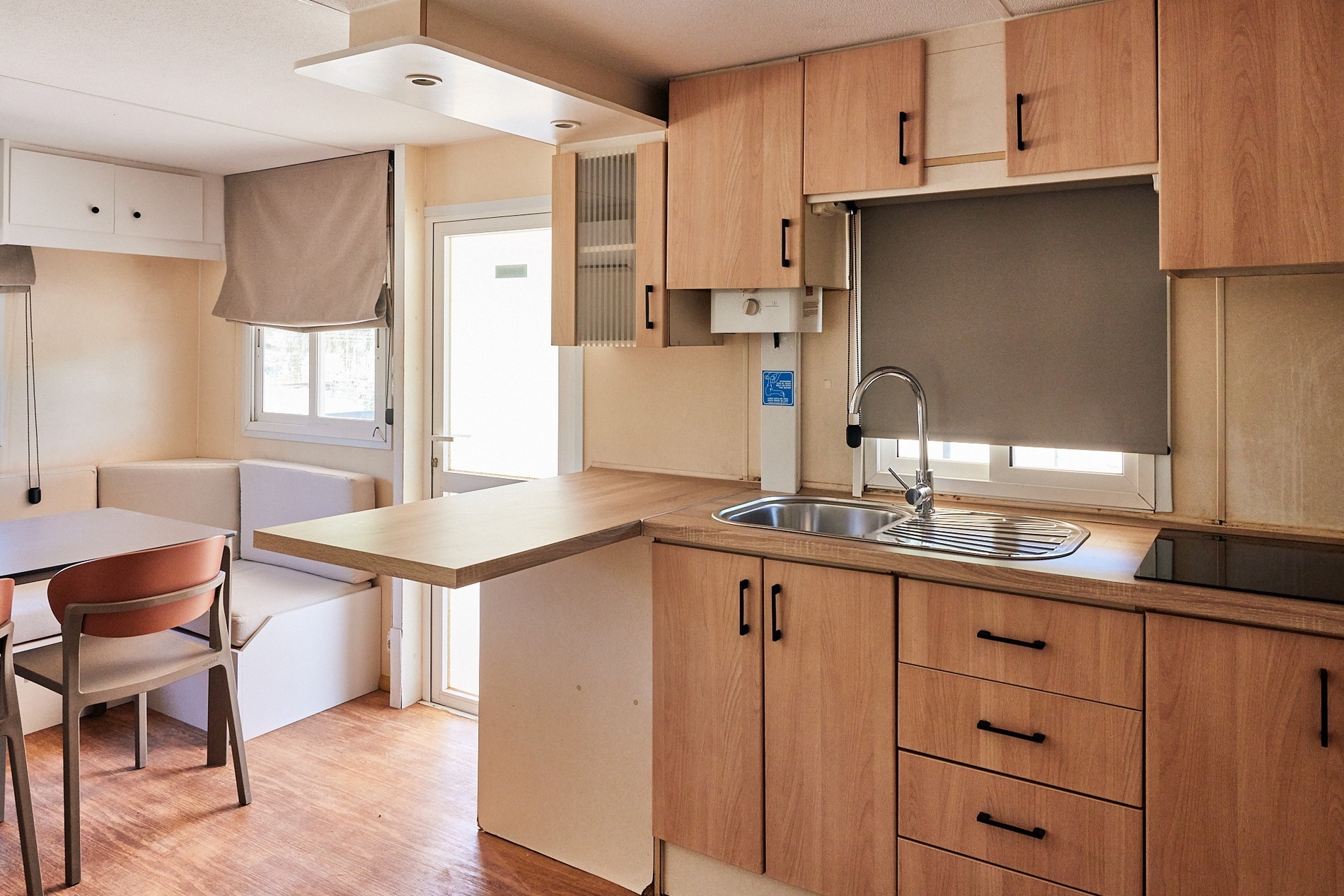 a kitchen with wooden cabinets and a stove top oven