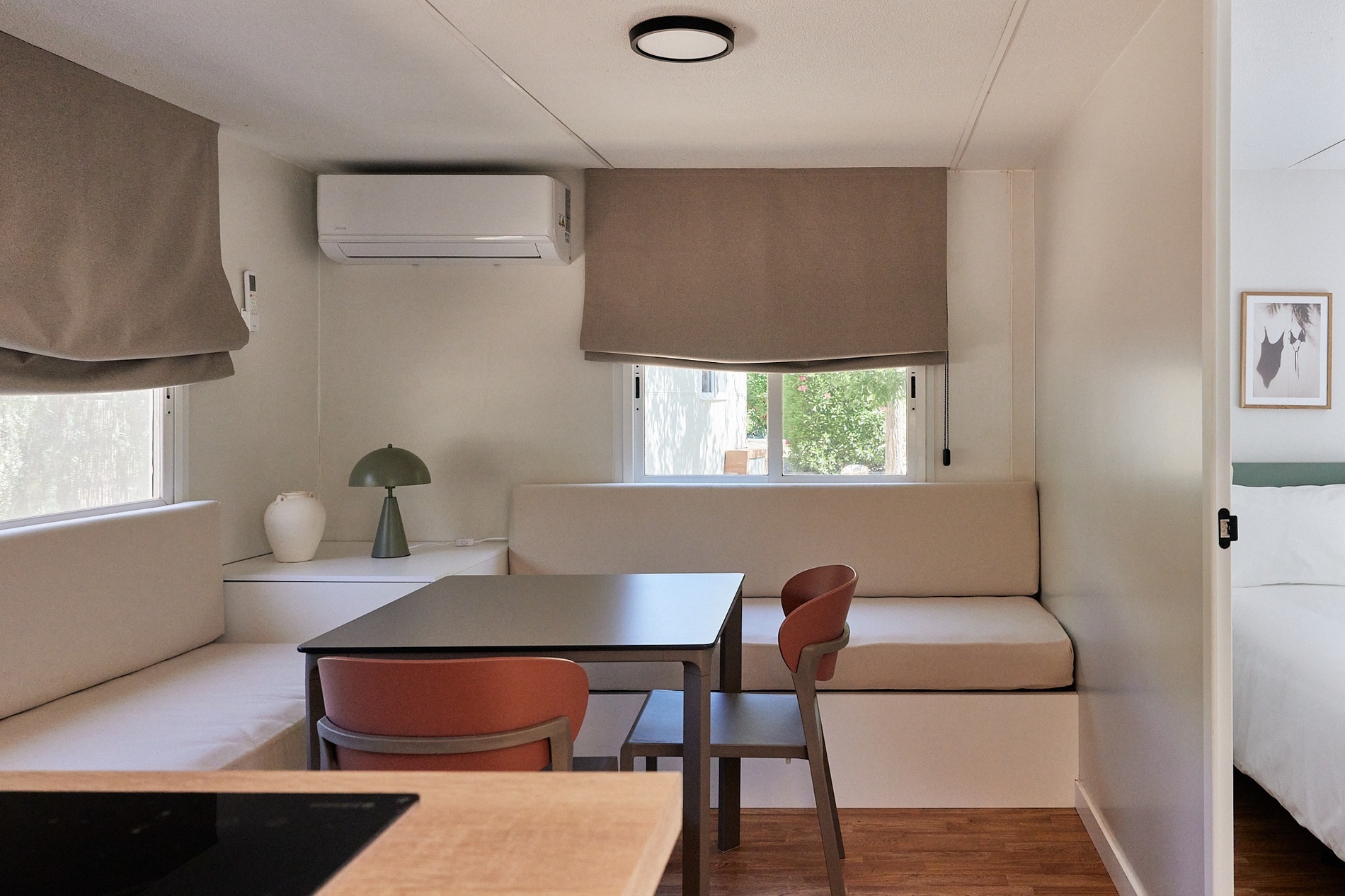 a small living room with a table and chairs