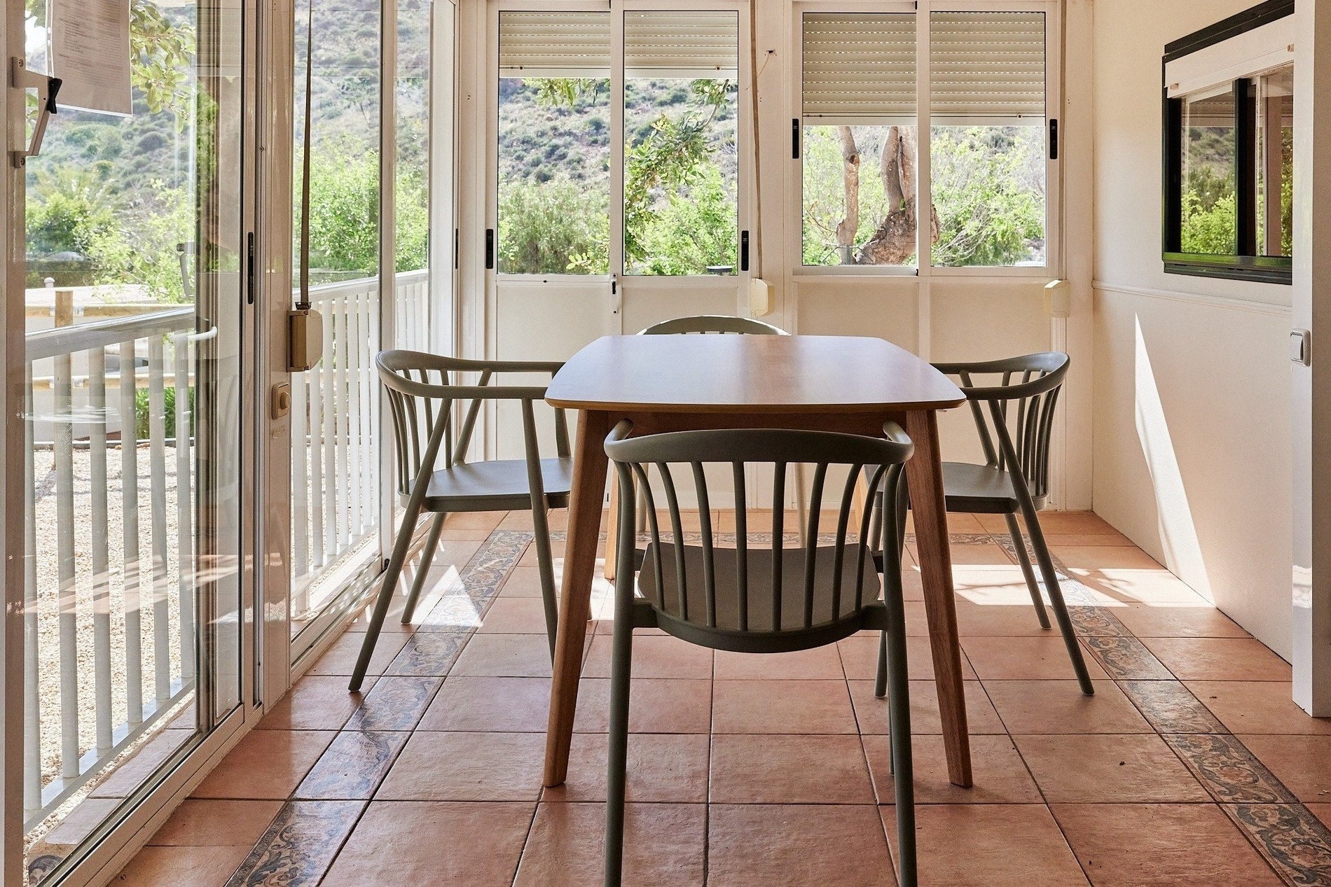 a table and chairs in a room with a sliding glass door