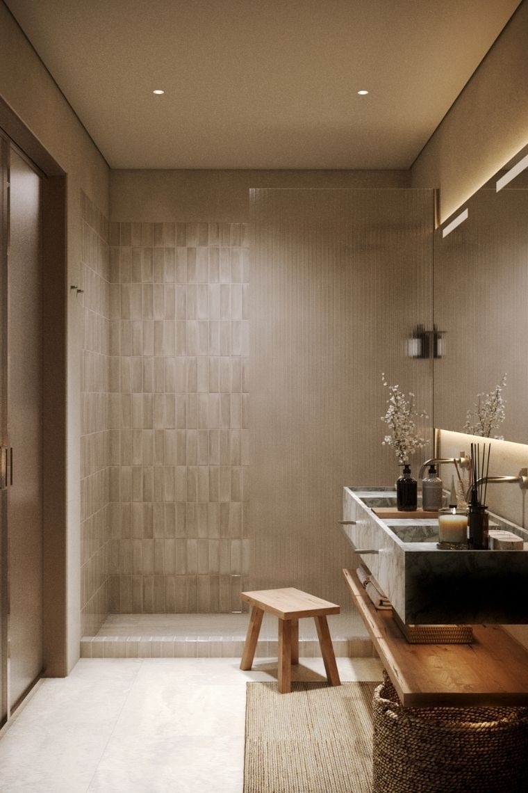 a bathroom with two sinks and a walk in shower