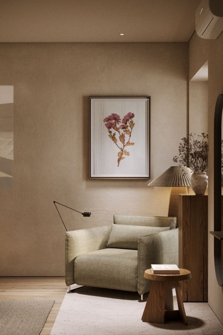 a living room with a couch and a painting on the wall