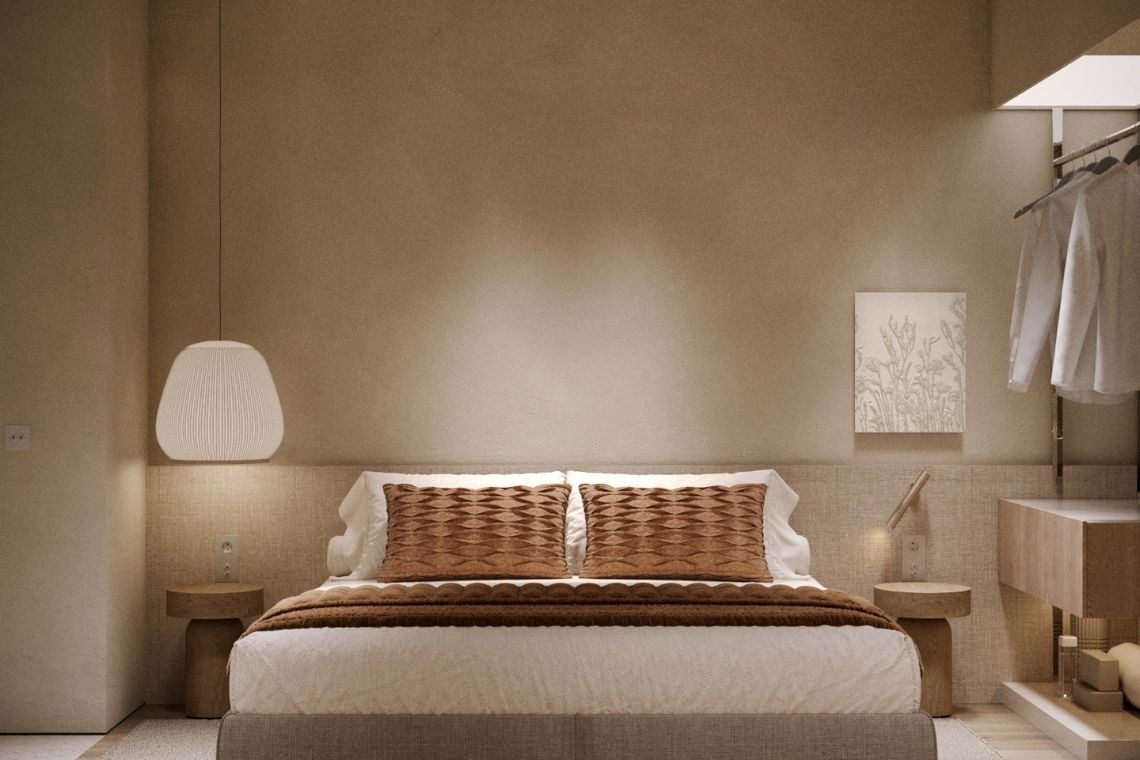 a bedroom with a painting on the wall above the bed