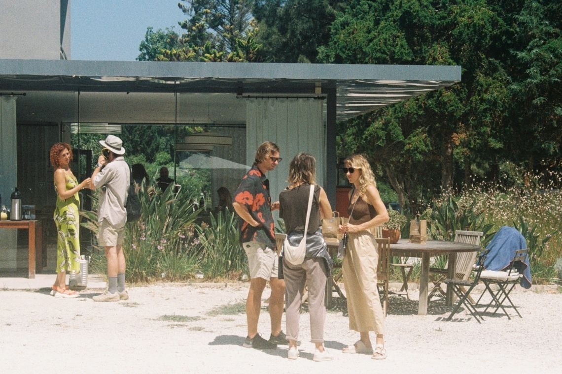 a group of people standing outside of a building