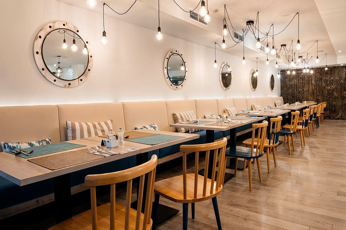 a woman wearing sunglasses is sticking her tongue out in a swimming pool