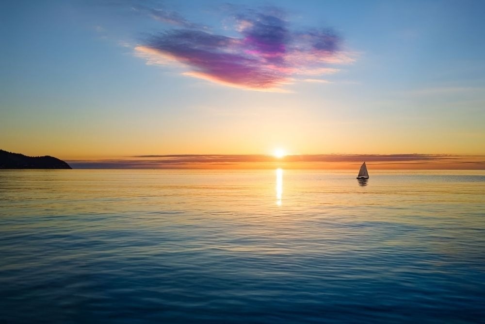a woman taking a picture of a building with a camera