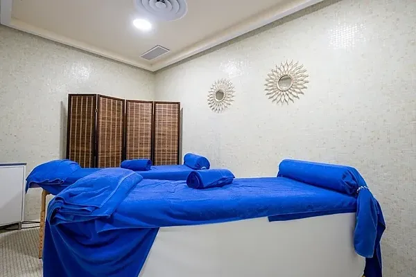 R2 Hoteles: Corporate indoor pool with waterfalls and jacuzzi.