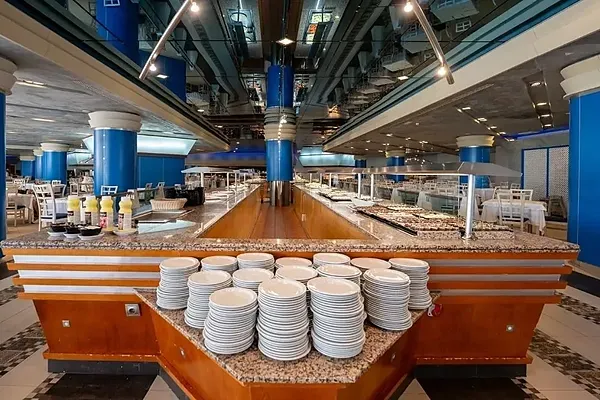 R2 Hotels: Spacious buffet with tables and chairs set for service.