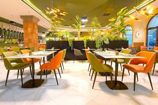 a woman wearing sunglasses is sticking her tongue out in a swimming pool