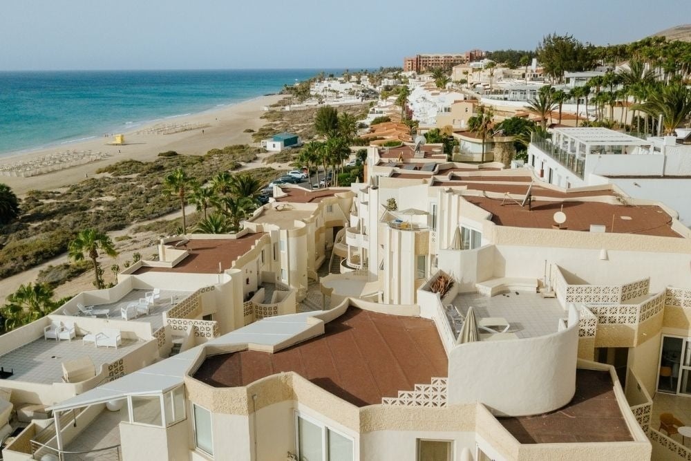 Aerial view of R2 Maryvent Beach Apartment, Fuerteventura, with beach and turquoise sea.