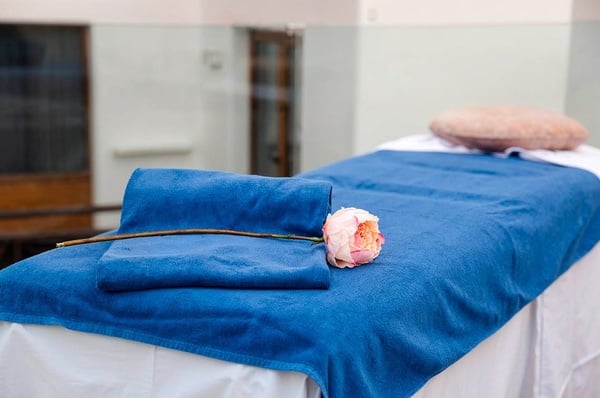 a woman taking a picture of a building with a camera