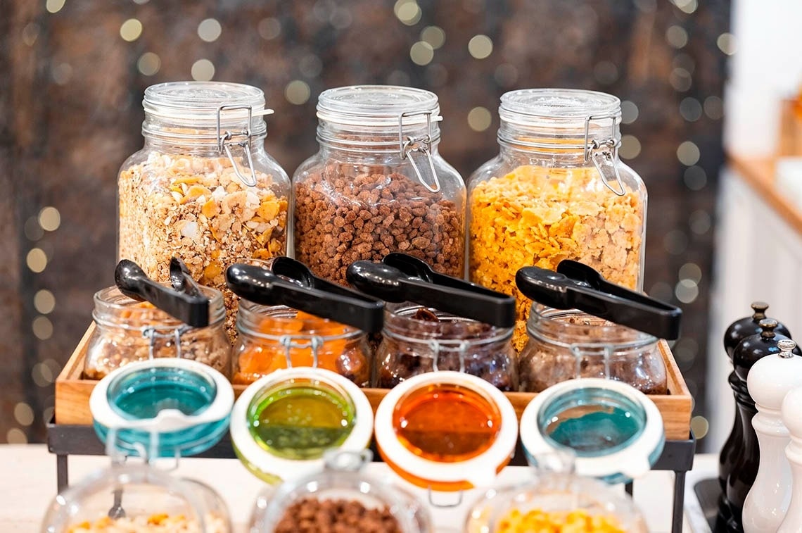 a woman wearing sunglasses is sticking her tongue out in a swimming pool