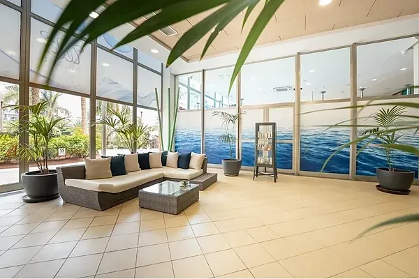 R2 Hoteles: Corporate indoor pool with waterfalls and jacuzzi.