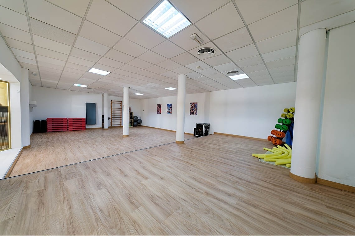 a woman taking a picture of a building with a camera