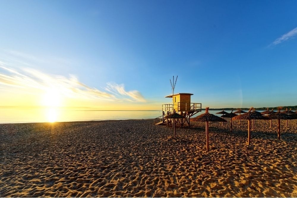 a woman taking a picture of a building with a camera