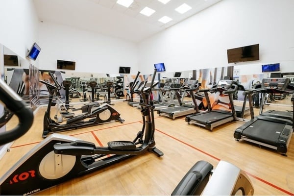 a woman taking a picture of a building with a camera