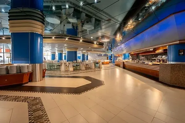 R2 Hotels: Spacious buffet with tables and chairs set for service.