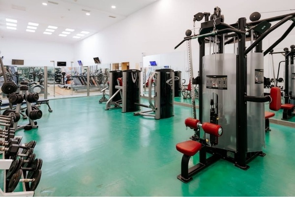a woman taking a picture of a building with a camera