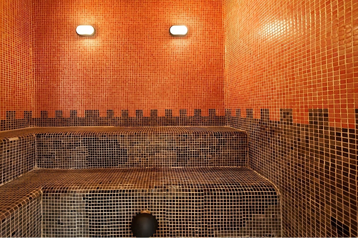 a woman taking a picture of a building with a camera