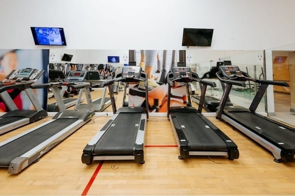 a woman taking a picture of a building with a camera
