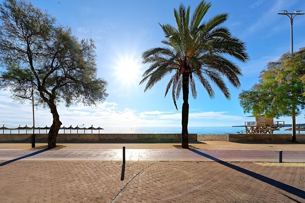 a white chair sits next to a tall white table