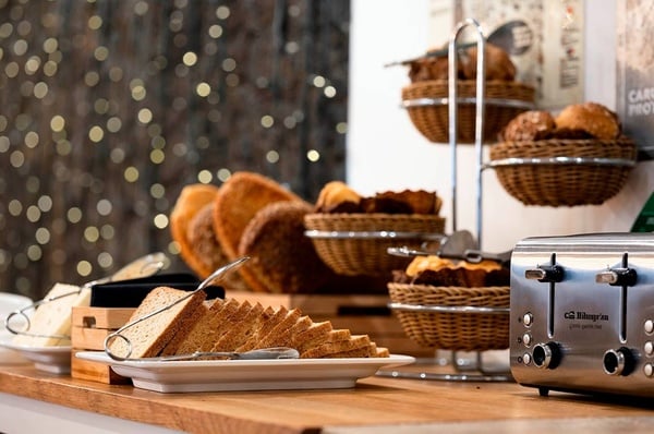 a woman wearing sunglasses is sticking her tongue out in a swimming pool