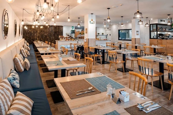 a woman wearing sunglasses is sticking her tongue out in a swimming pool