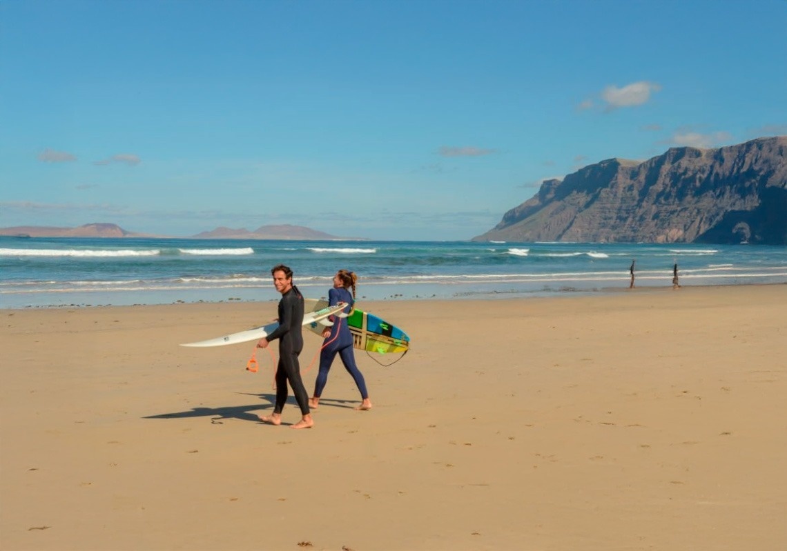 a woman taking a picture of a building with a camera
