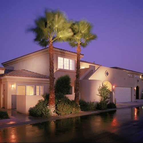 Travel Raintree Corpo: Modern, sunny apartments at dusk.