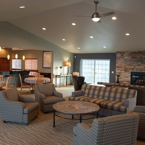 Travel Raintree Corpo Lounge: sofas, stone fireplace, tables and chairs.