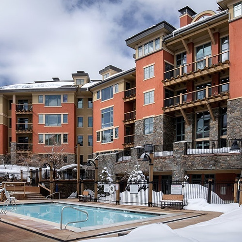 Heated outdoor pool at a luxury Travel Raintree Corpo hotel during winter.
